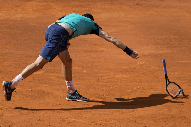 Grigor Dimitrov of Bulgaria smashes his racquet during his match against Rafael Nadal of Spain at the Madrid Open Tennis tournament in Madrid, Spain, Friday, May 8, 2015. (AP Photo/Paul White)