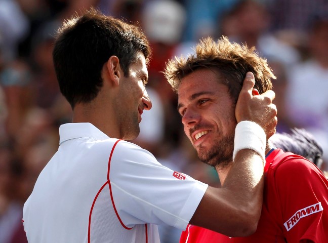 Novak Djokovic of Serbia is congratulated by Stanislas Wawrinka of Switzerland (R) after Djokovic won their men's semi-final match at the U.S. Open tennis championships in New York September 7, 2013.       REUTERS/Adam Hunger (UNITED STATES  - Tags: SPORT TENNIS TPX IMAGES OF THE DAY)