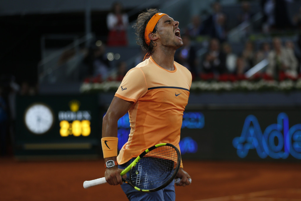 Rafael Nadal, from Spain, celebrates after winning his match against Joao Sousa, from Portugal, during a Madrid Open tennis tournament in Madrid, Spain, Friday, May 6, 2016. Nadal won 6-0, 4-6 and 6-3. (AP Photo/Francisco Seco)