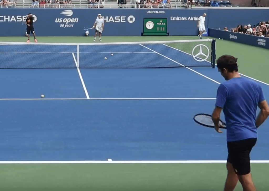 Federer practising with his old racquet at the US Open - why?